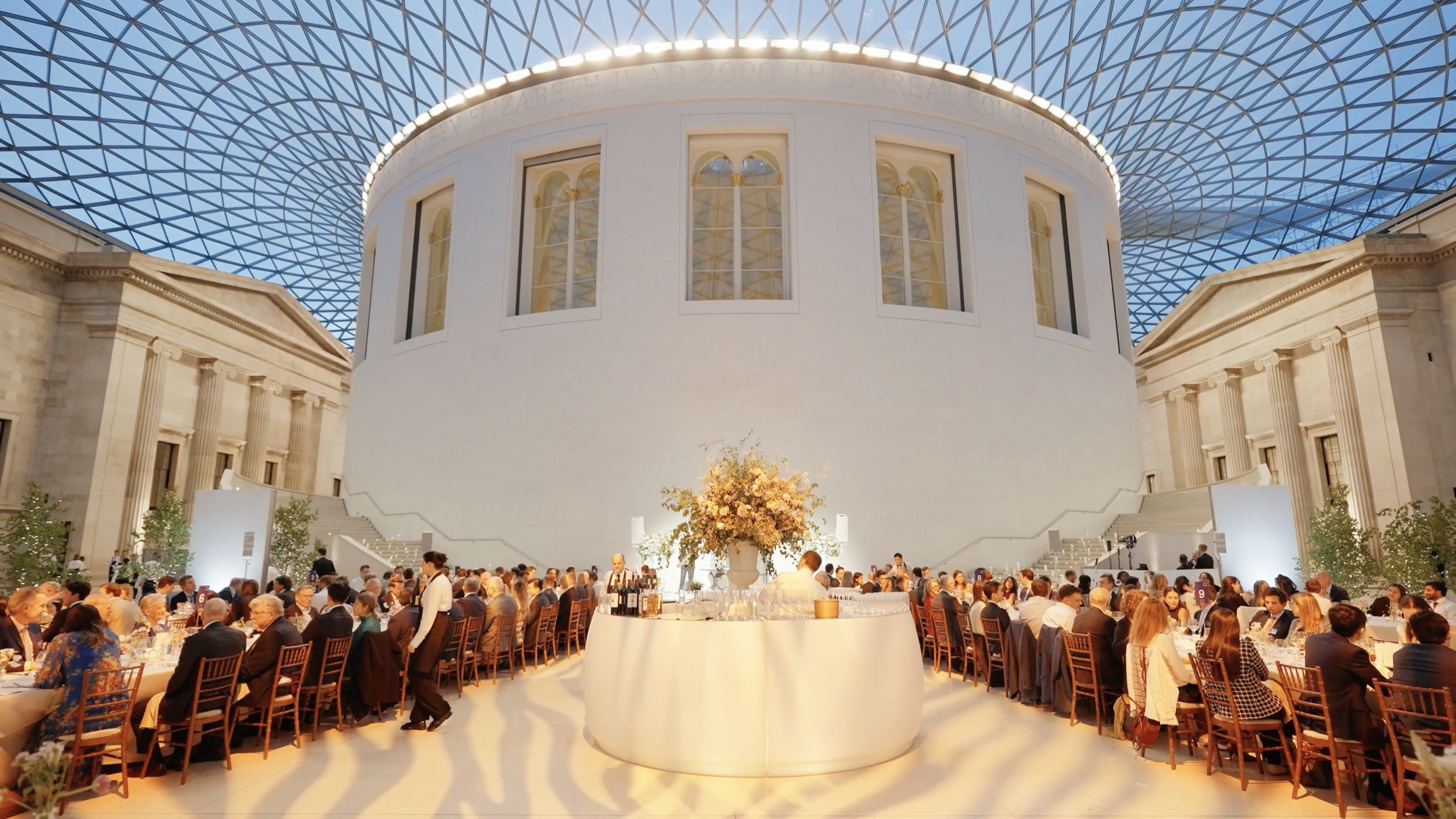  - Premium gala dinner setup with elegant styling in the Great Court under the glass roof at the British Museum